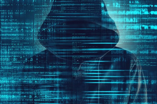 Computer-hacker-wearing-a-black-hoodie-cybersecurity.jpg