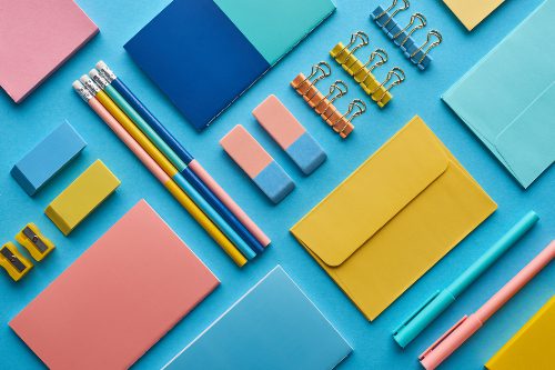 top-view-of-notebooks-and-arranged-colorful-stationery.jpg