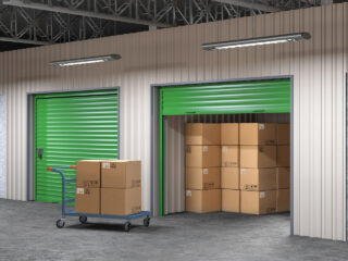 storage hall with open storages door and wheelbarrow with boxes 3d illustration Stock Photo