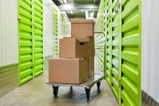 cardboard boxes in empty hall of self storage facility