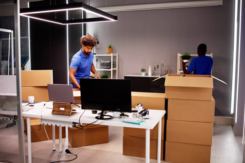 https://crsmove.com/wp-content/uploads/2024/10/Movers-Packing-Boxes.jpg