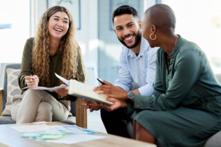 Happy business people smile during a planning meeting